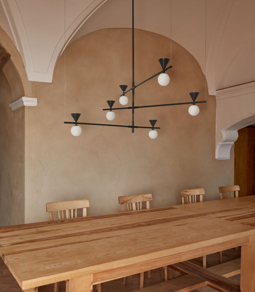 Aromas Oneta·L Pendant Light hanging over dining table