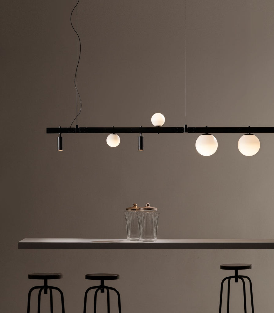 Karman Stant Linear Pendant Light featured within a interior space