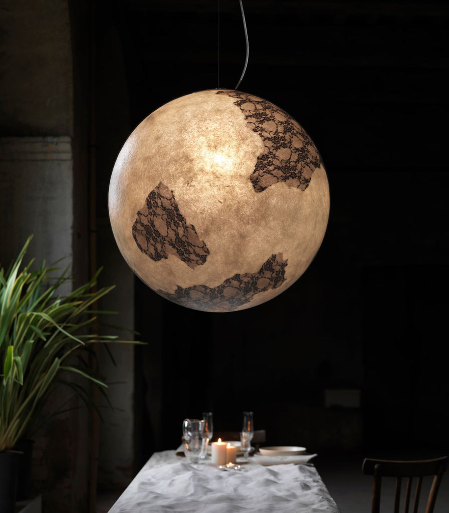 Karman Ululi Ulula Pendant Light hanging over dining table
