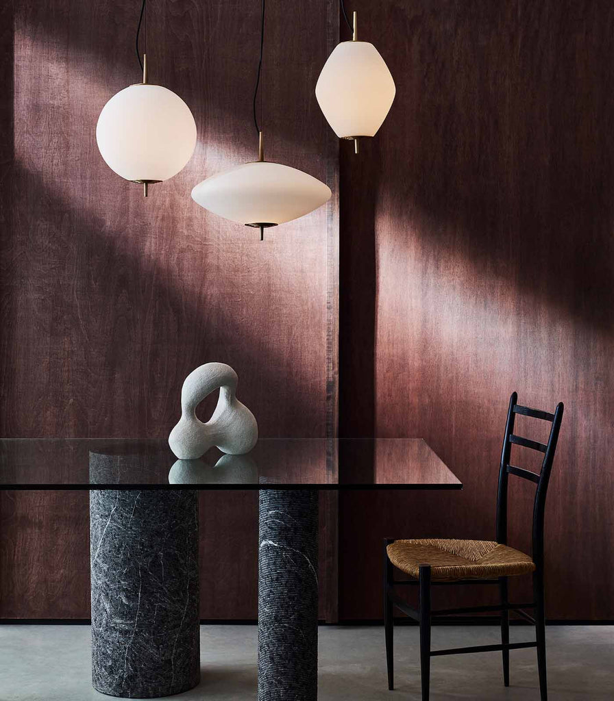 J. Adams & Co. Nova Tall Pendant Light hanging over dining table