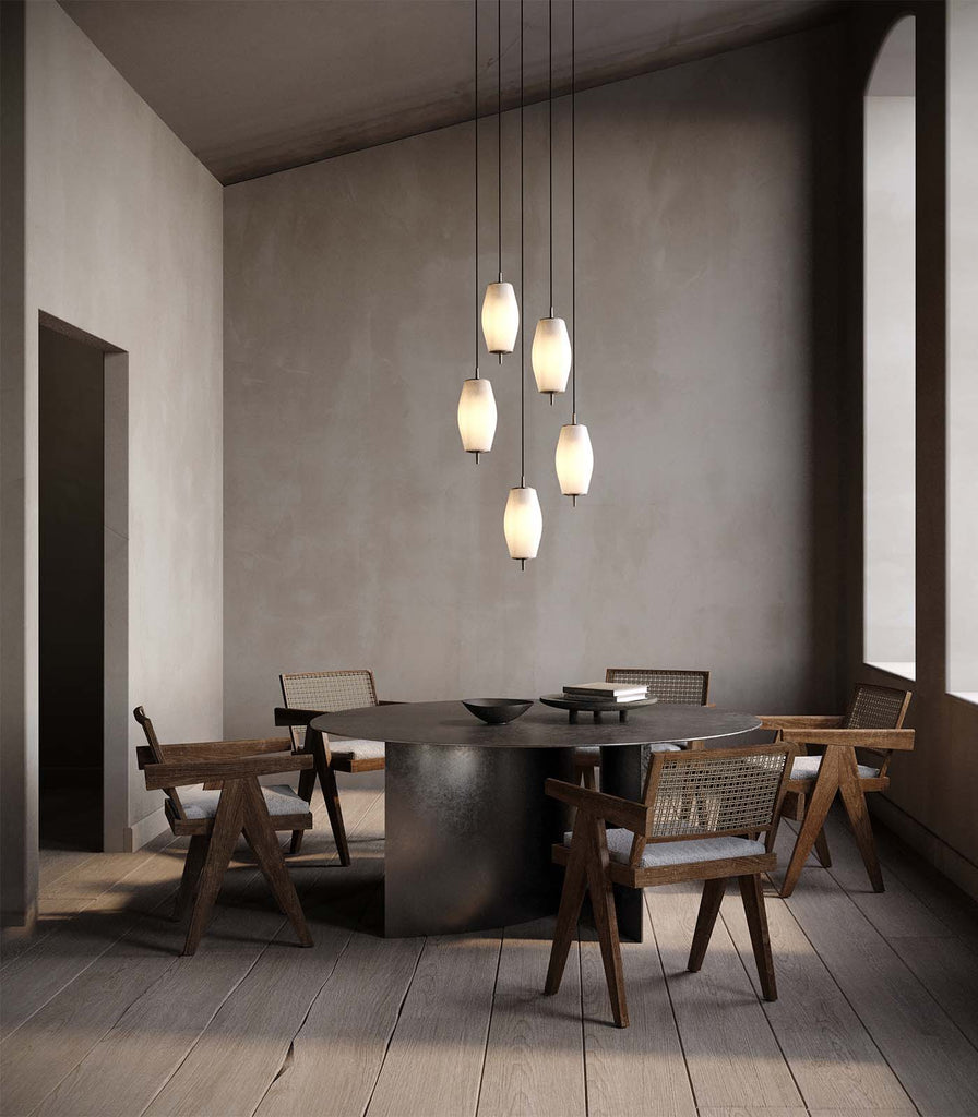 J Adams & Co. Nova Slim Pendant Light hanging over dining table