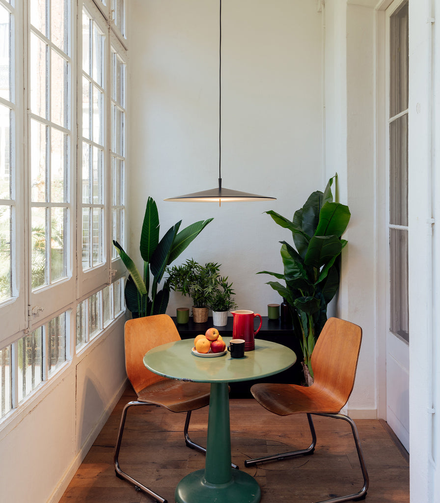 Milan Pla Pendant Light hanging over dning table