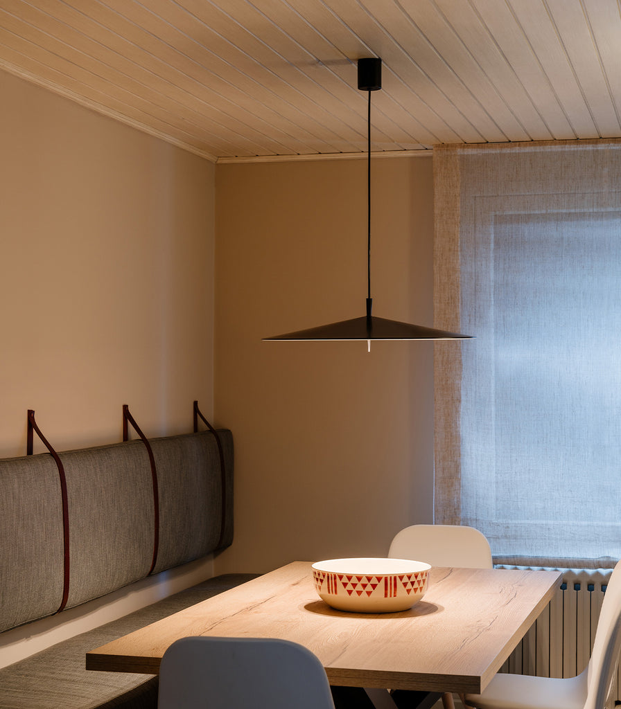 Milan Pla Pendant Light hanging over dning table