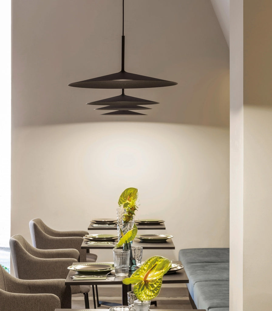 Linea Light Poe Plus Pendant Light featured within interior space