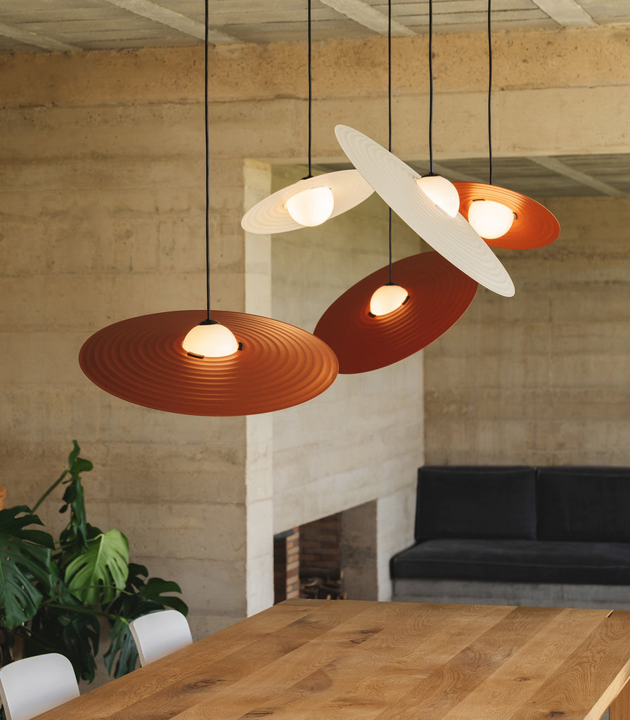 Milan Symphony Pendant Light hanging over dining table