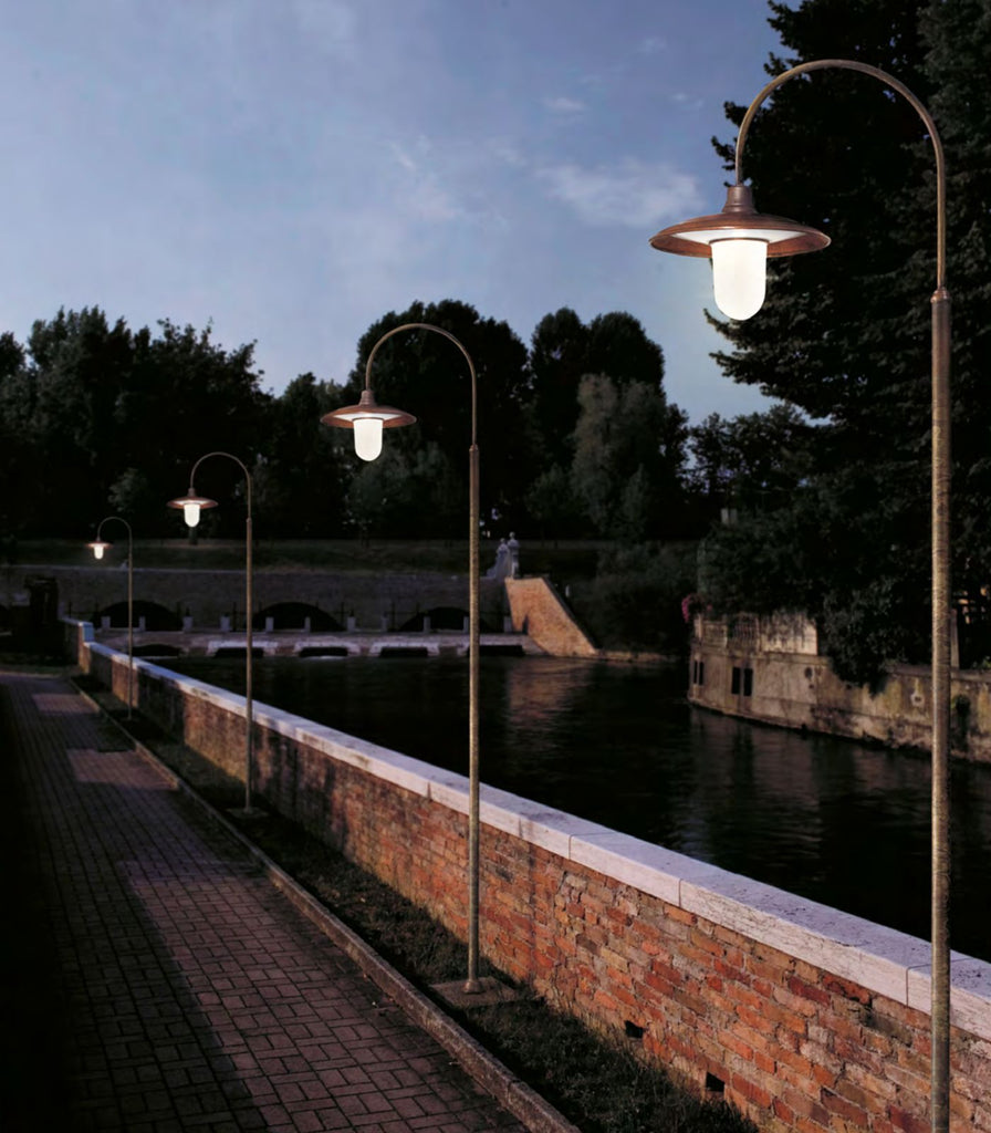 Il Fanale Barchessa Curve Pole Light featured within a outdoor space