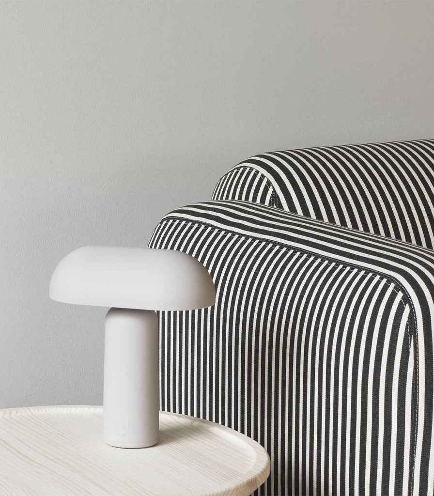 Normann Copenhagen Porta Table Lamp featured within interior space