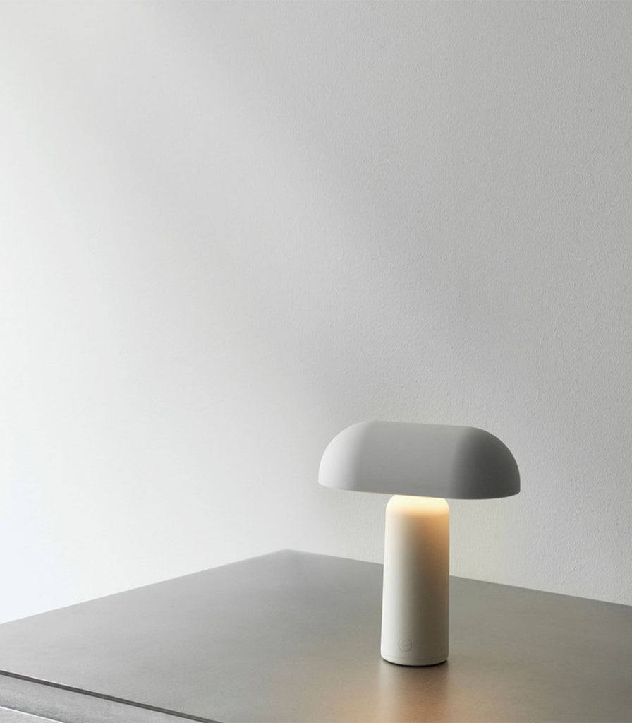 Normann Copenhagen Porta Table Lamp featured within interior space
