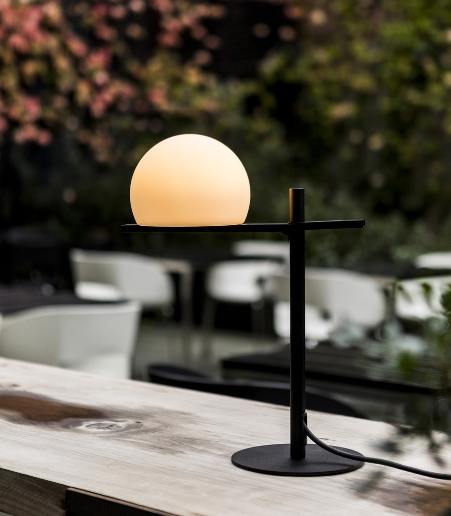 Estiluz Circ Outdoor Table Lamp featured within outdoor space