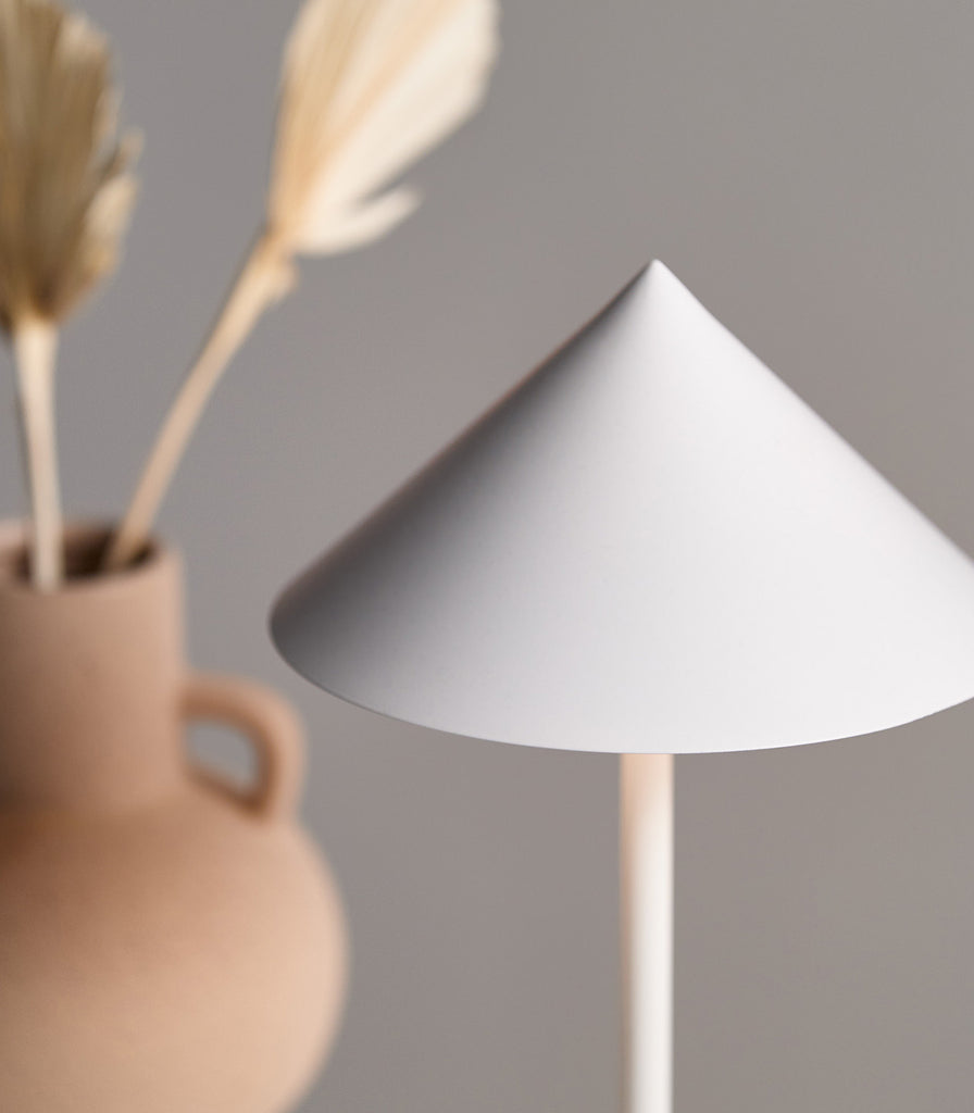 Mayfield Floris Portable Table Lamp featured within interior space