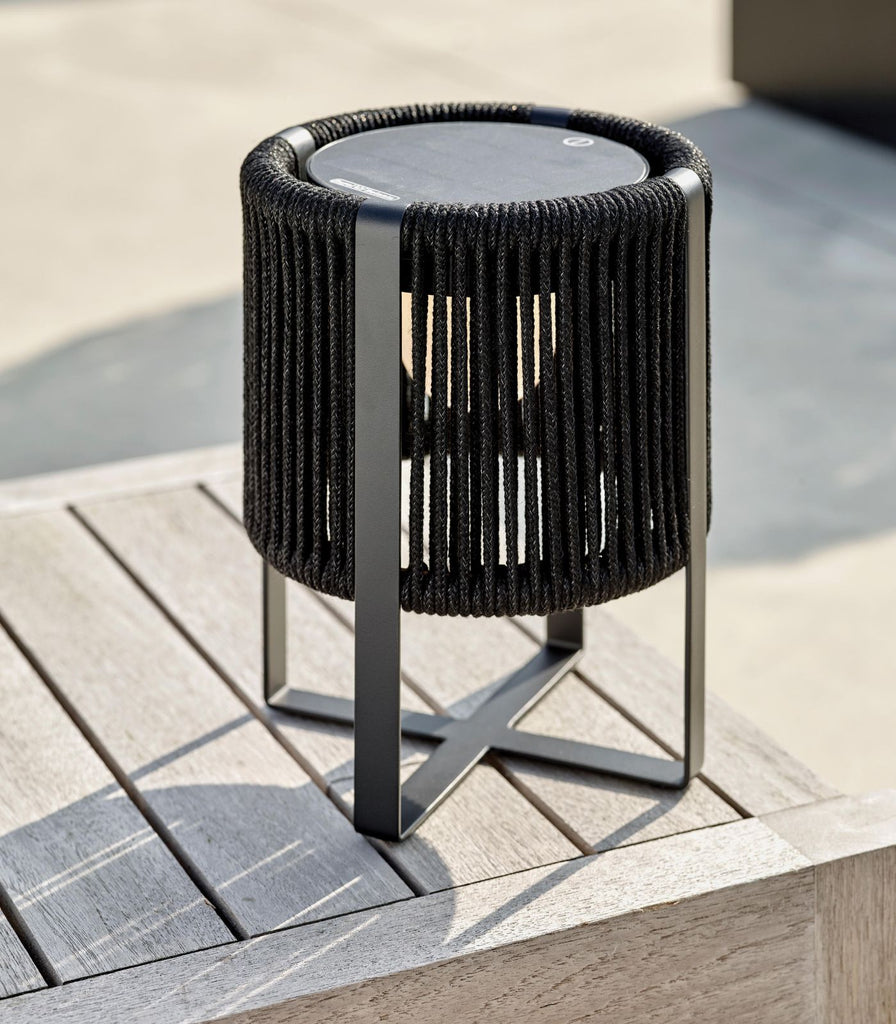 Royal Botania Ropy Table Lamp featured within a outdoor space