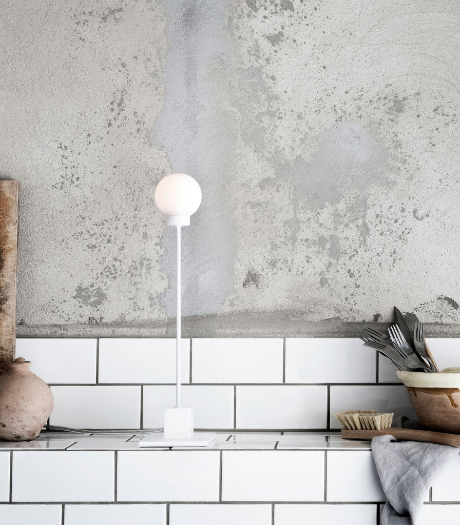 Northern Snowball Table Lamp featured within a interior space