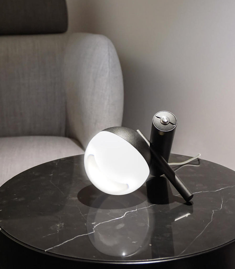 Linea Light Rossini Table Lamp featured within interior space