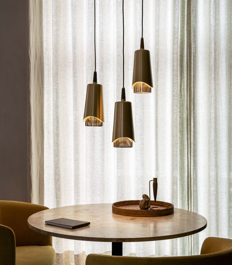 Menu Lighting Umanoff Pendant Light fratured within interior space