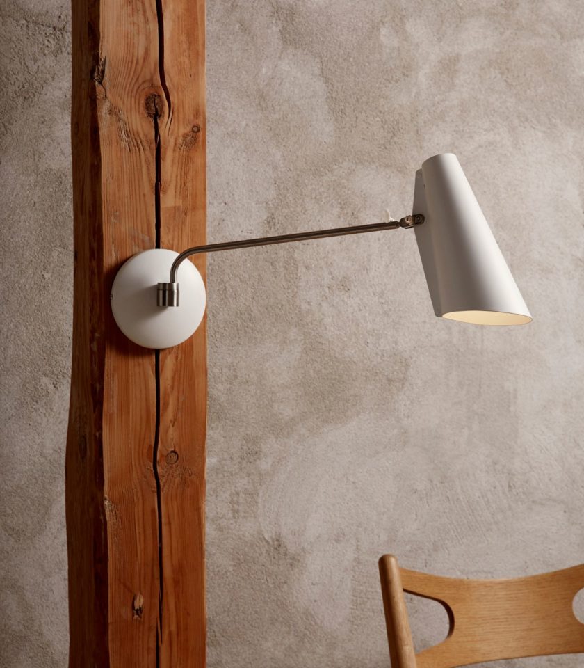 Northern Birdy Swing Wall Lamp featured within a interior space