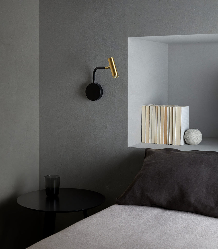 Aromas Maho Wall Light featured above bedside table"