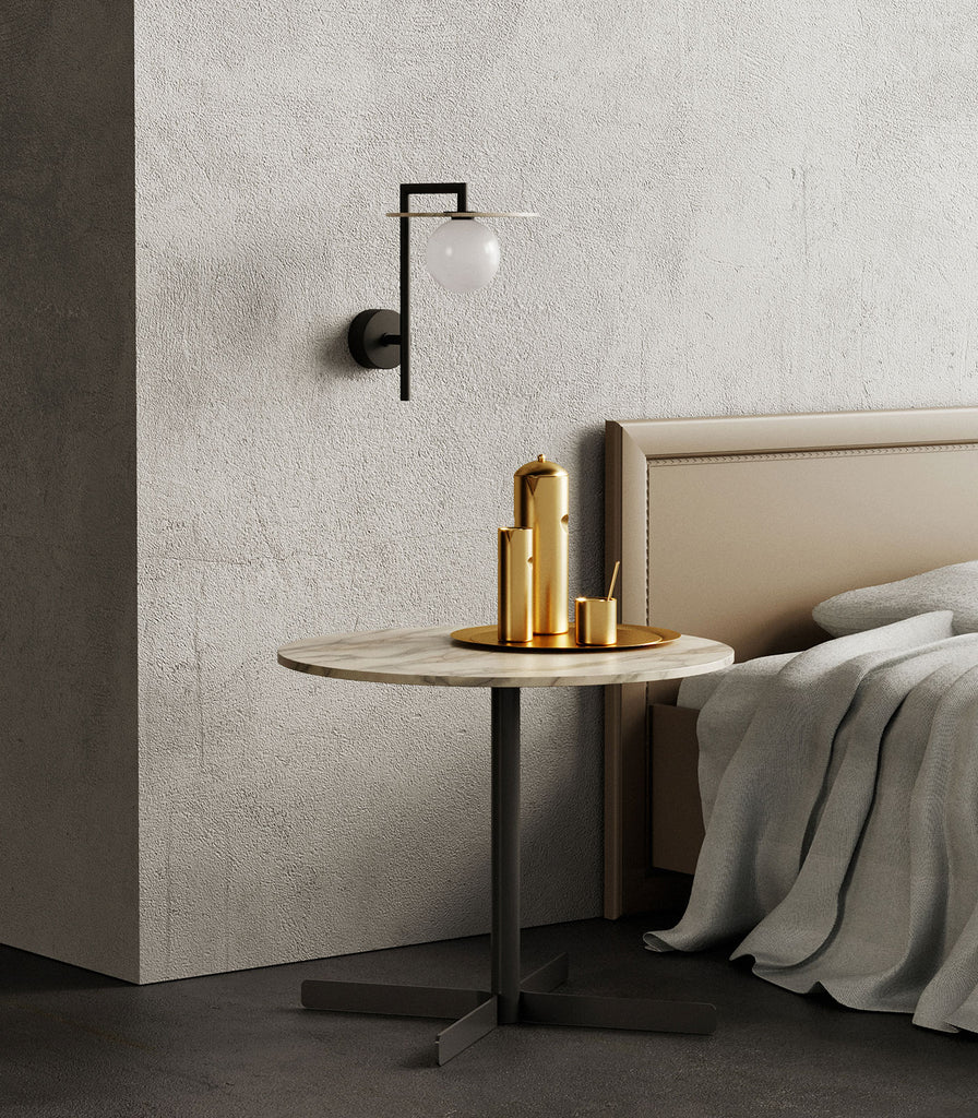 Aromas Miro Wall Light featured above bedside table