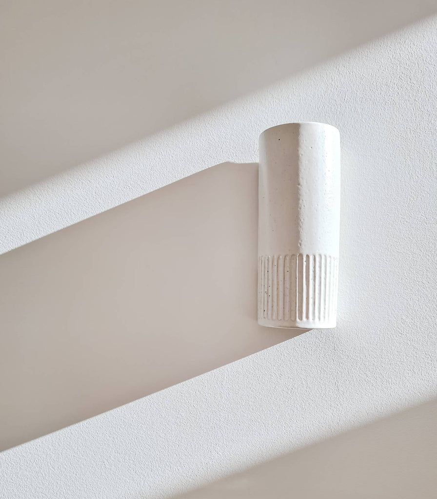 We Ponder Day Tall Wall Light in Eggshell White against white wall