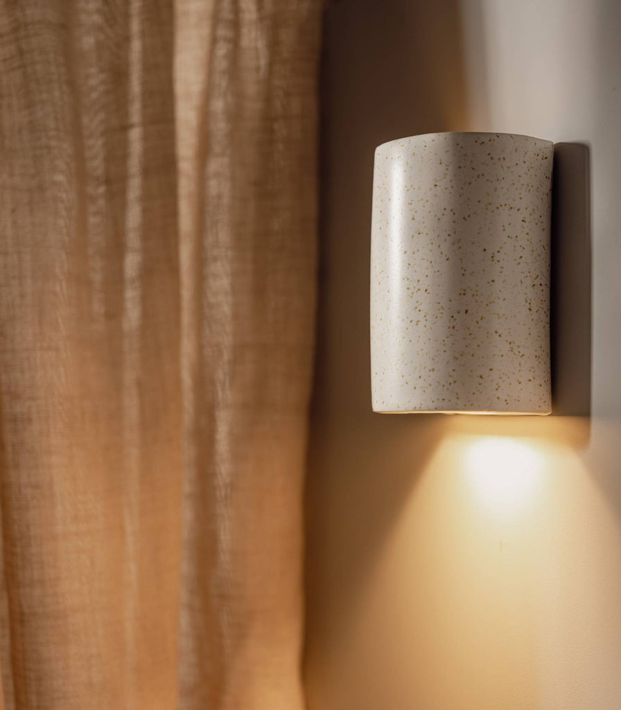 We Ponder Freckles Short Wall Light in Beige/Fleck finish turned on