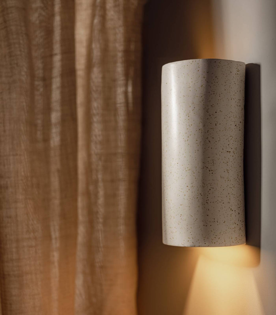 We Ponder Freckles Tall Wall Light in Beige/Fleck finish turned on