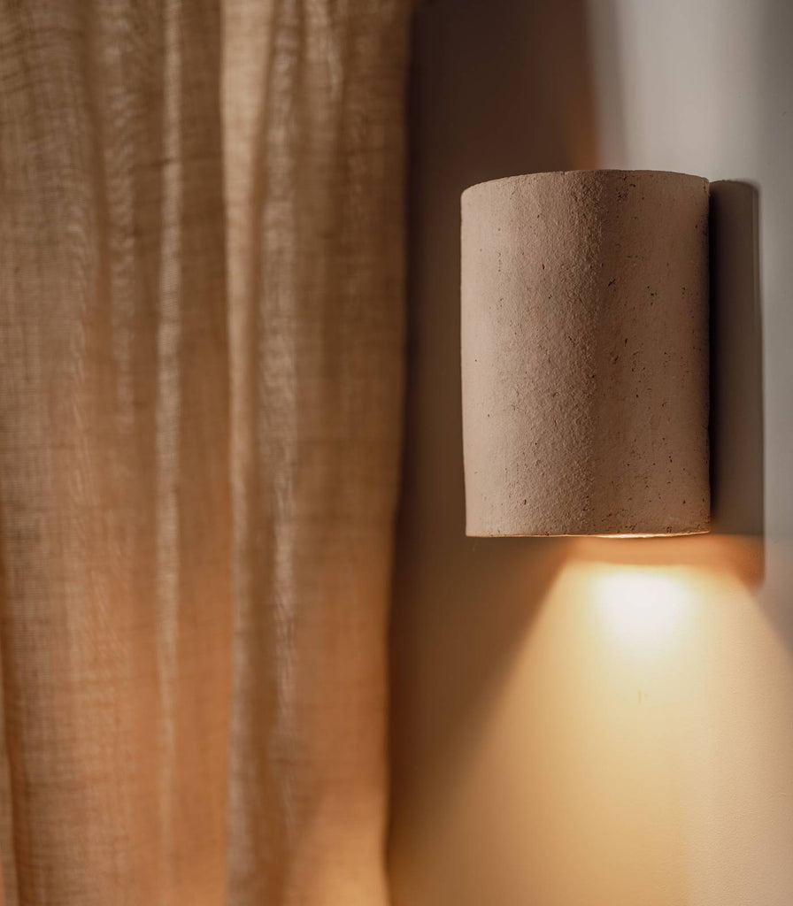 We Ponder Nudie Wall Light in Raw Clay finish turned on