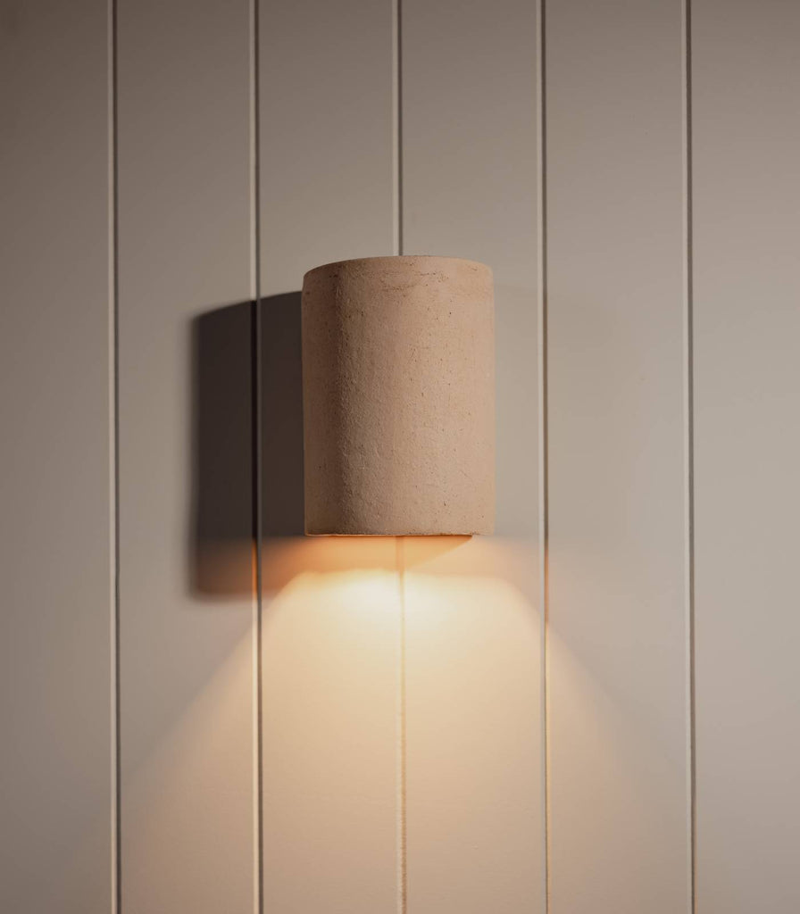 We Ponder Nudie Outdoor Wall Light in Raw Clay finish on